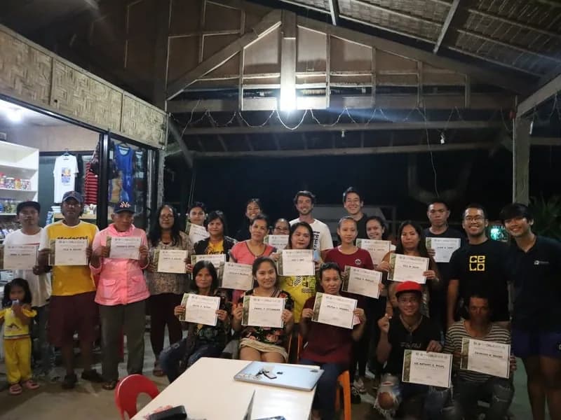 Certificate ceremony with community members in the Philippines
